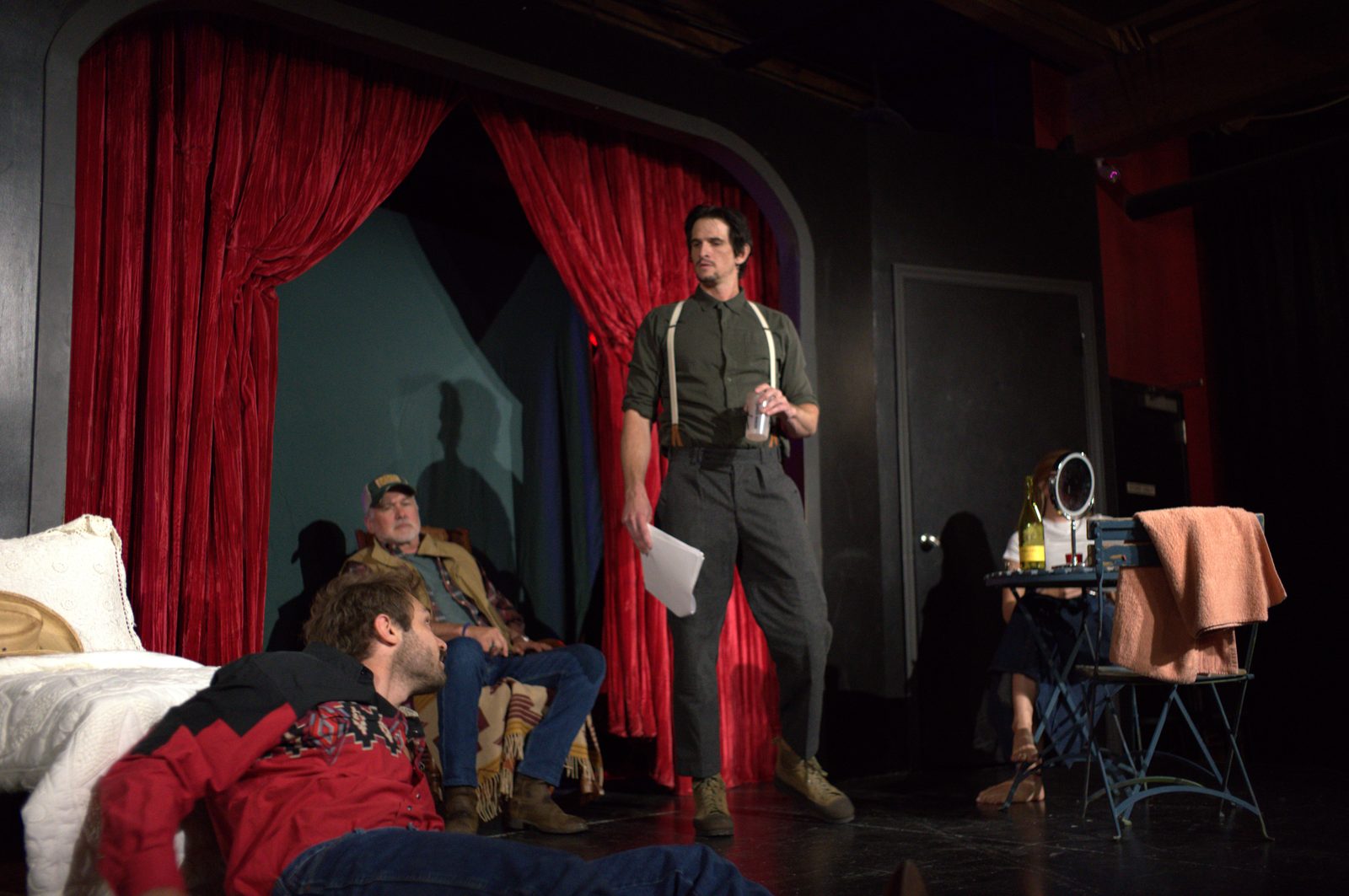 Fool for Love: the cast on stage in front of the red curtains